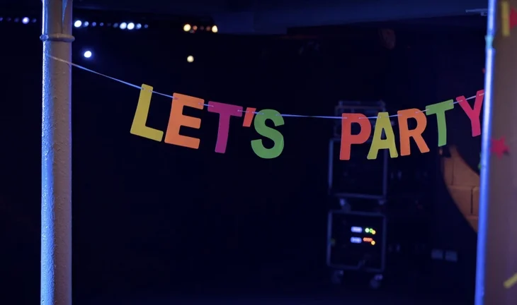 A sign that says lets party 