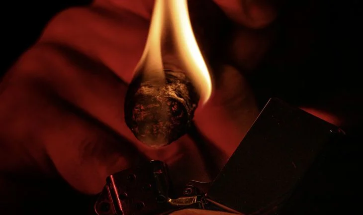 lighting a cigar